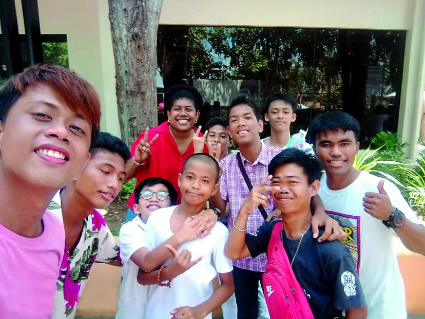 Lanieta Tamatawale with some of the children and young people she works with in the Archdiocese of Cagayan de Oro’s Deaf Ministry.