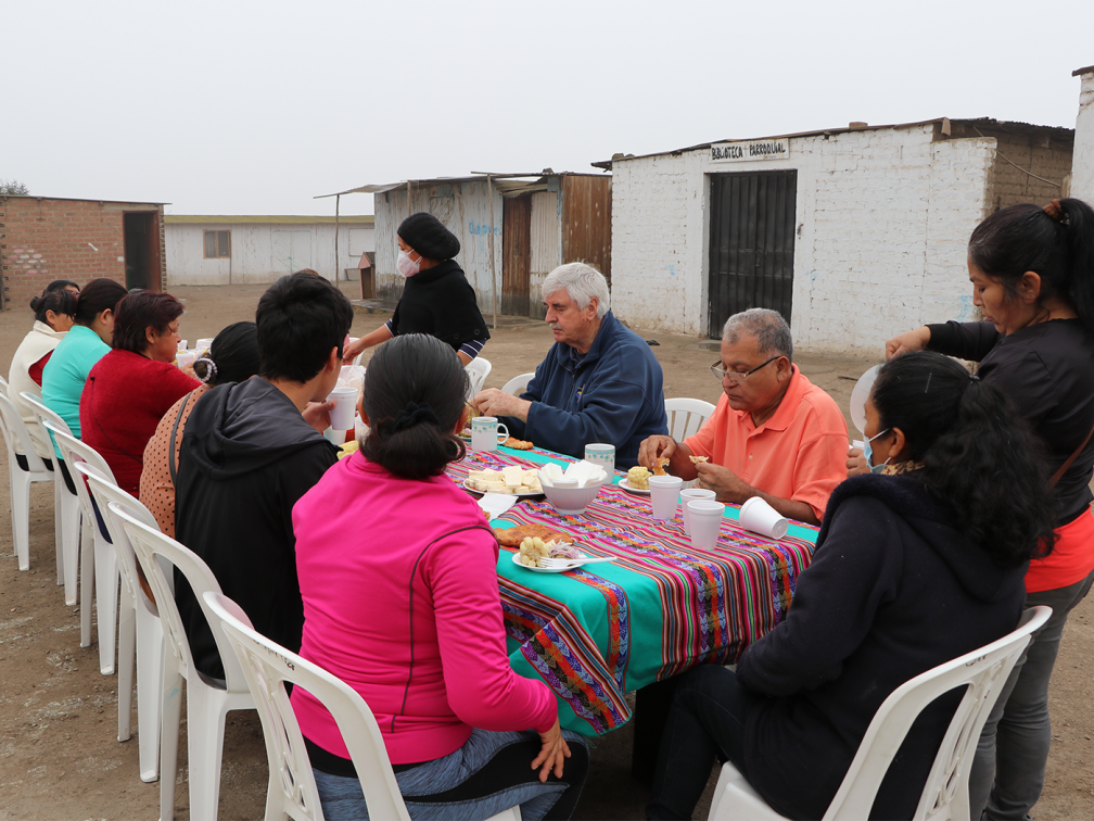 people sit at a table to eat breakfast
