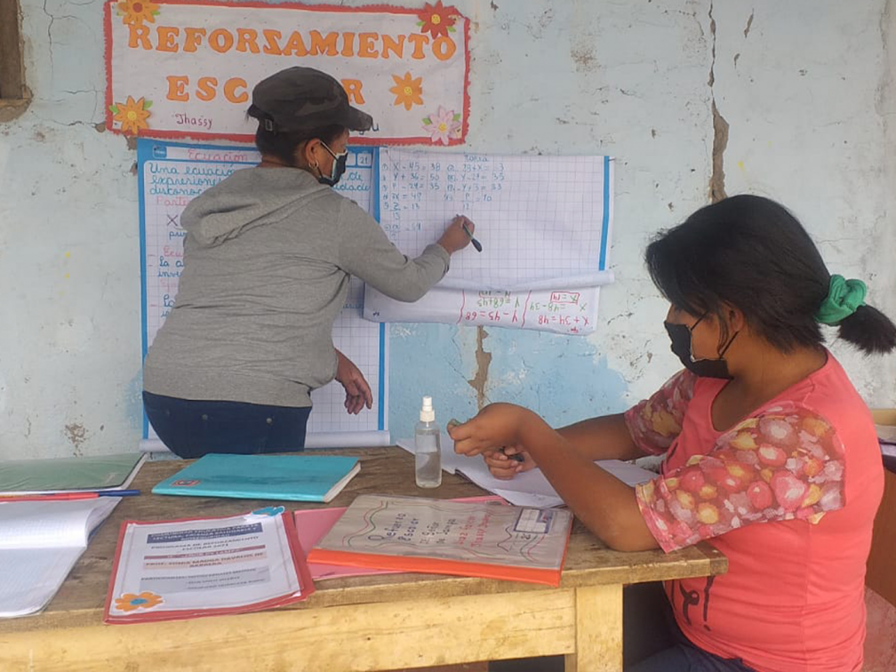teacher and child studying