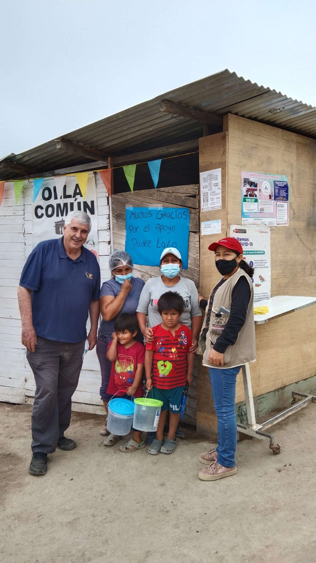 Group outside the communal kitchen with Fr. Ed O'Connell