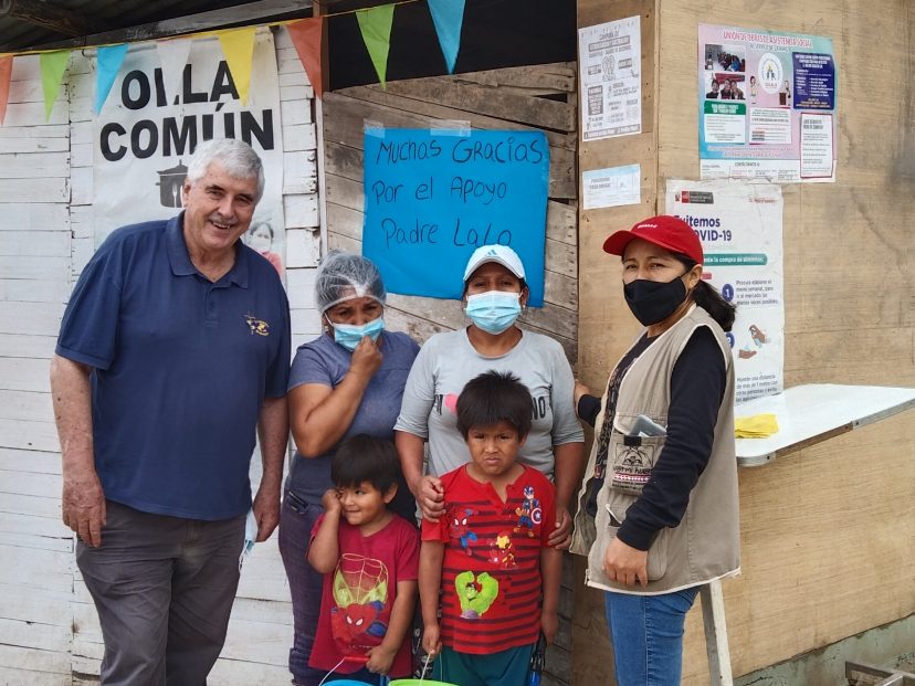 Group outside the communal kitchen with Fr. Ed O'Connell