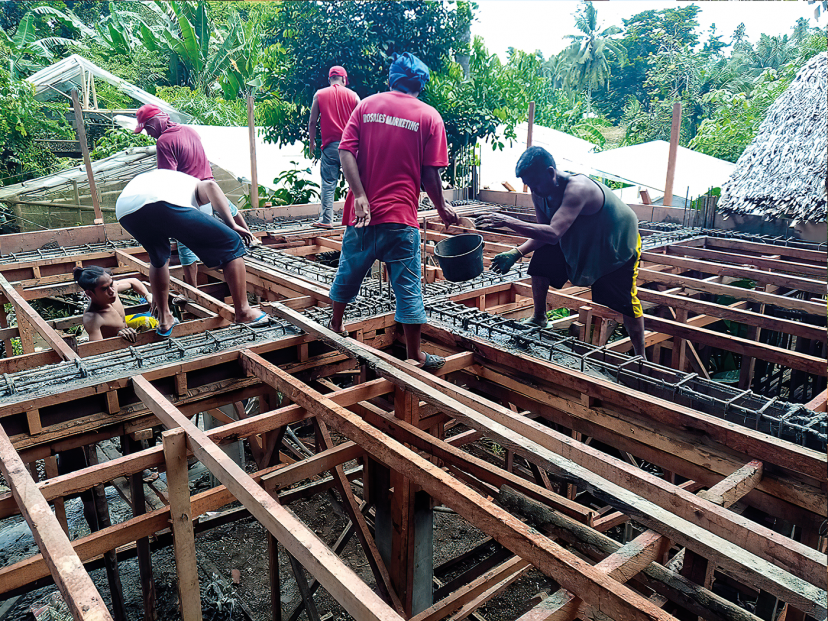 men stand on timber frames