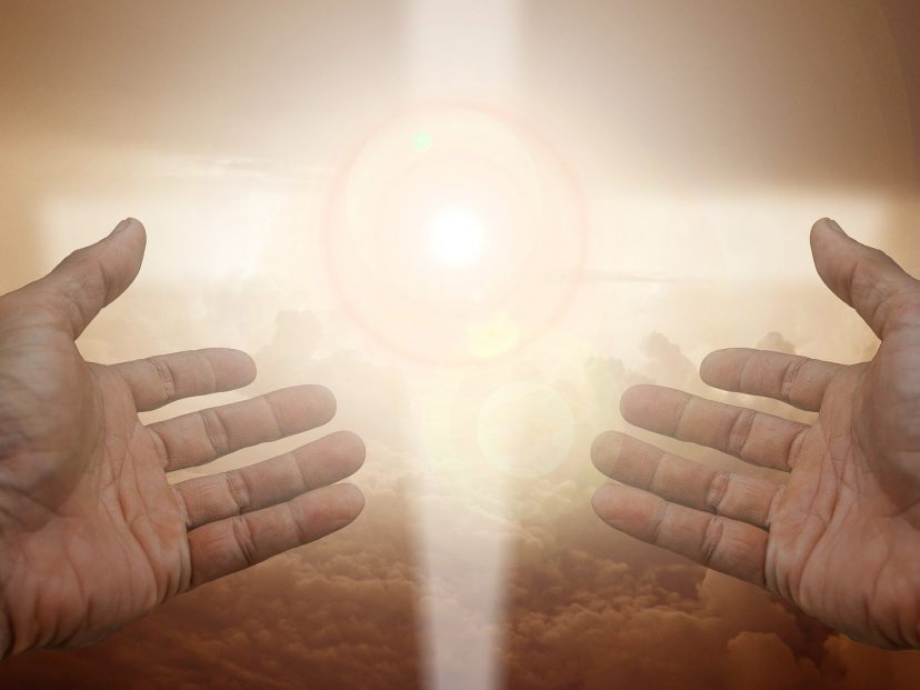 crucifix and hands open