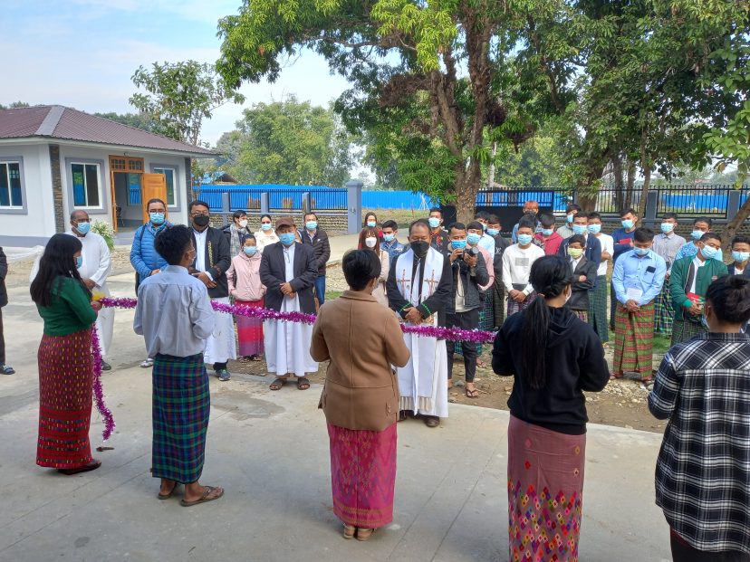 people gather for a blessing