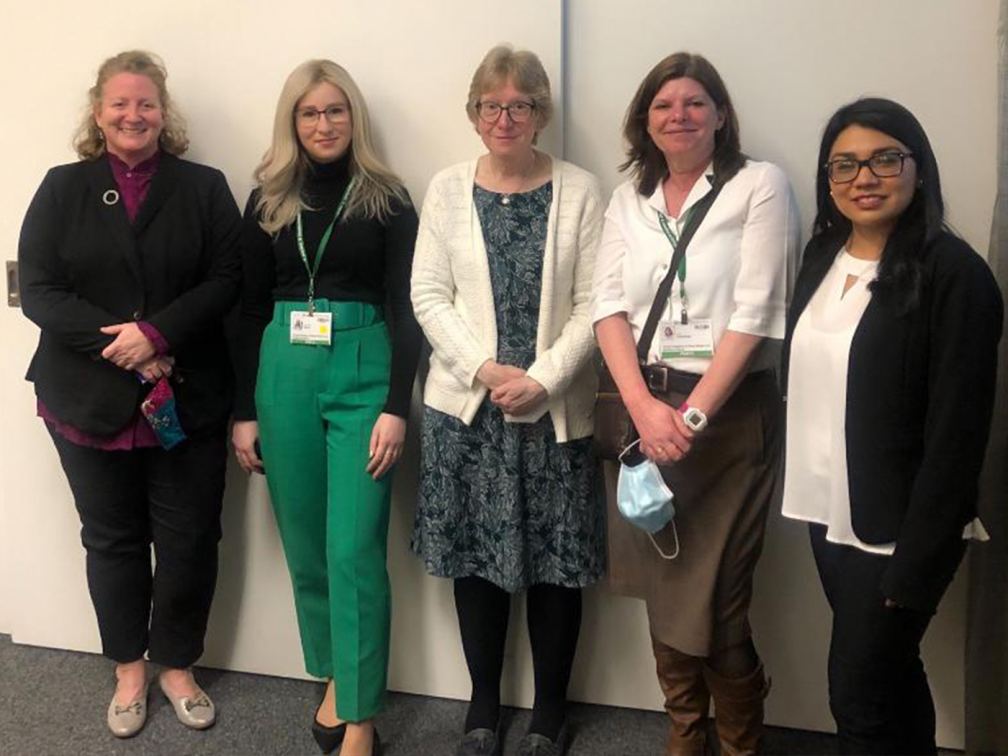 five female look at the camera