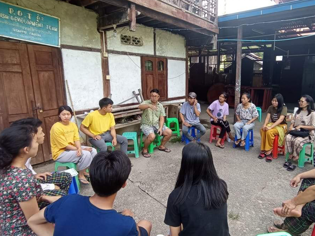 students sit around in circle