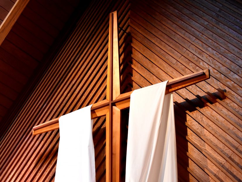 cross with drapes hung