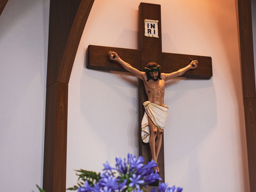 crucifix with floral arrangement