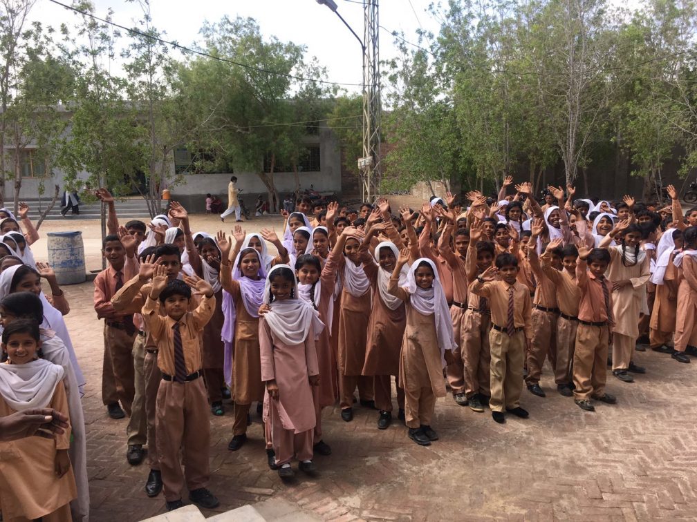 children file patiently for school