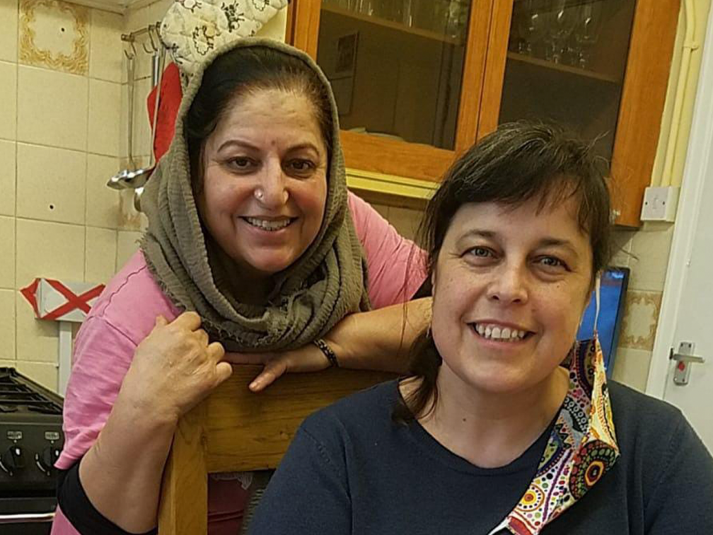 two women smile at camera