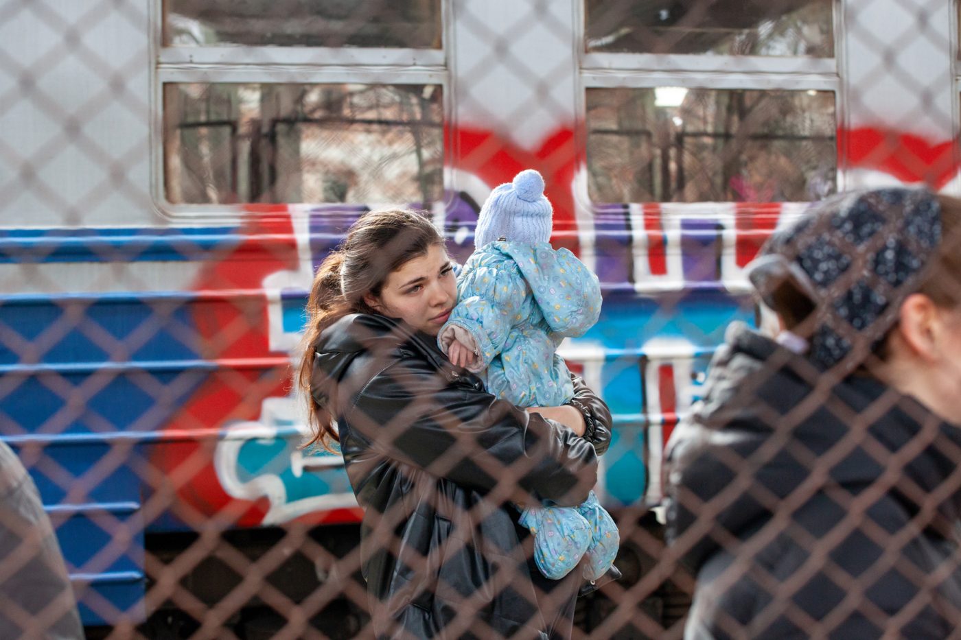 woman and baby flee Ukraine
