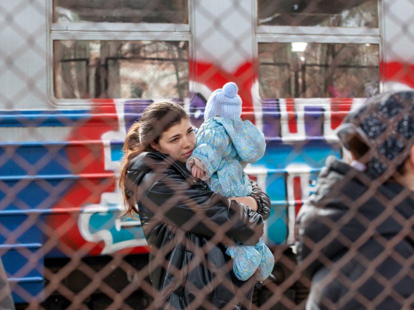 woman and baby flee Ukraine