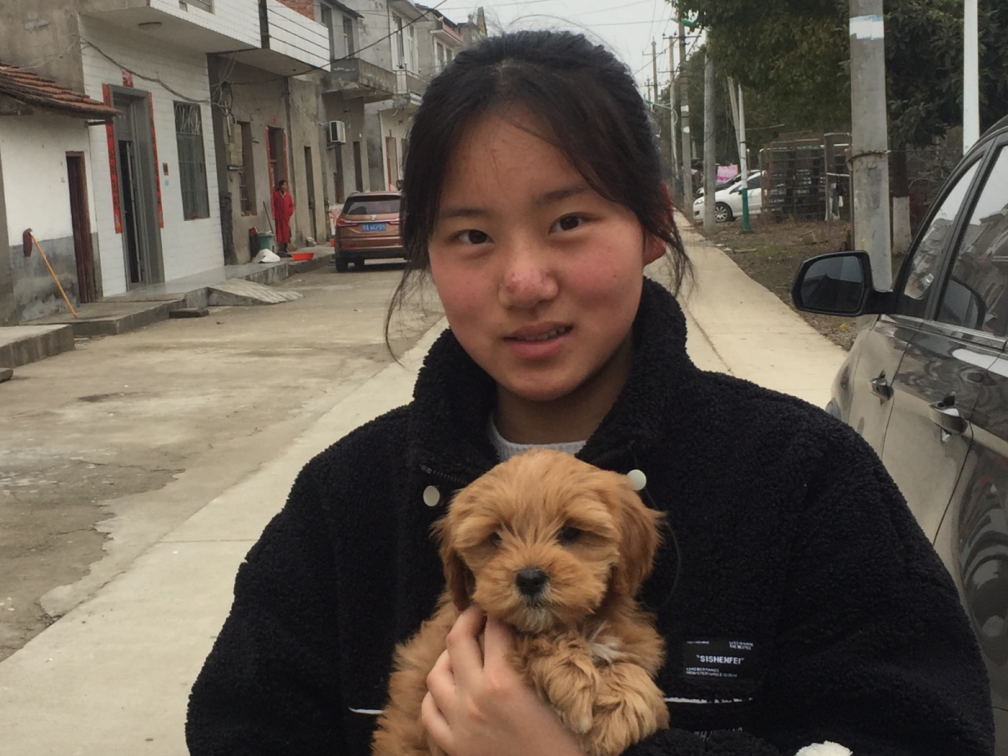 Lily holding a puppy