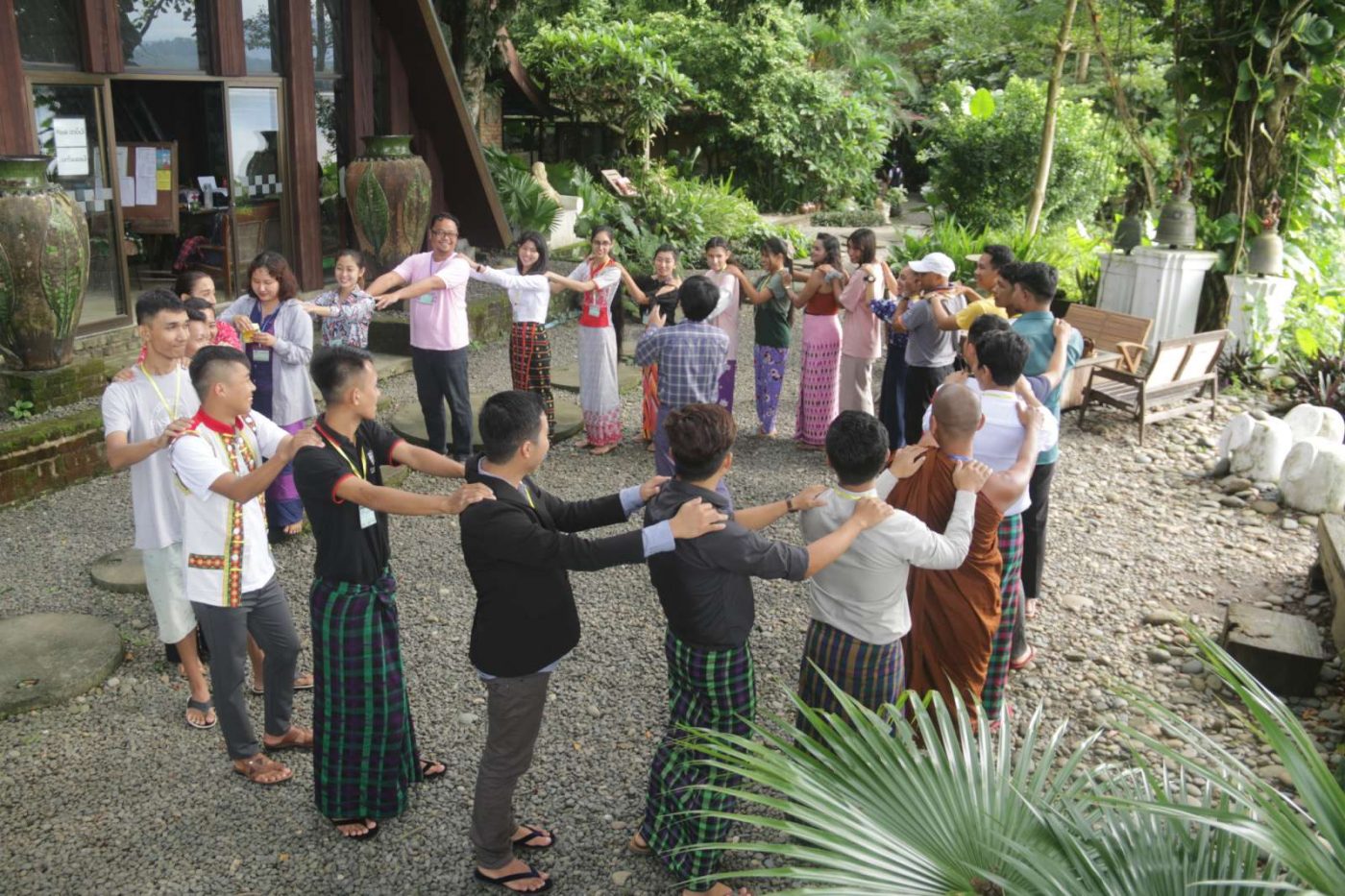 group stand together in a circle