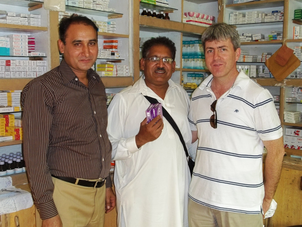 Three men inside a pharmacy