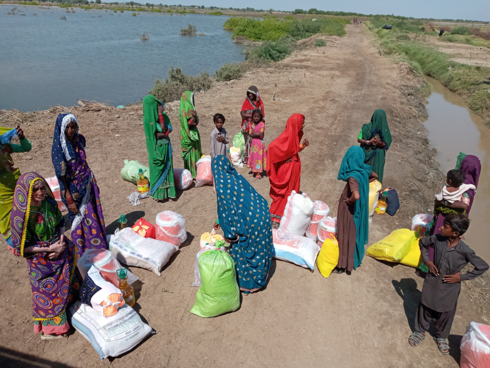 Parkari Kohli people receiving food ration, mosquito nets and a medical kit
