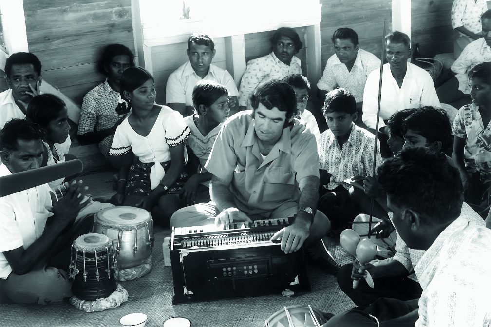 A young Fr. Frank Hoare with singing with Indo-Fijian parishioners