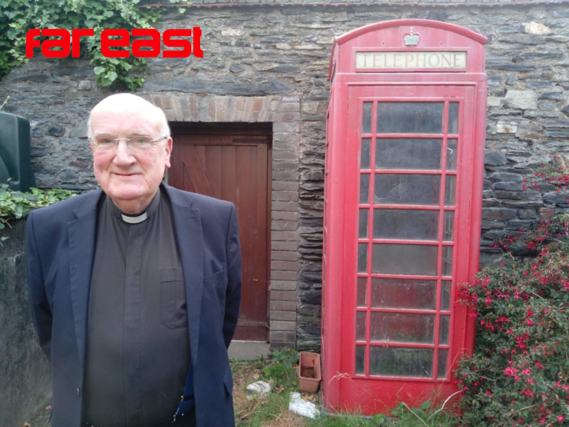 Fr. Brian O'Mahoney and his beloved red telephone box