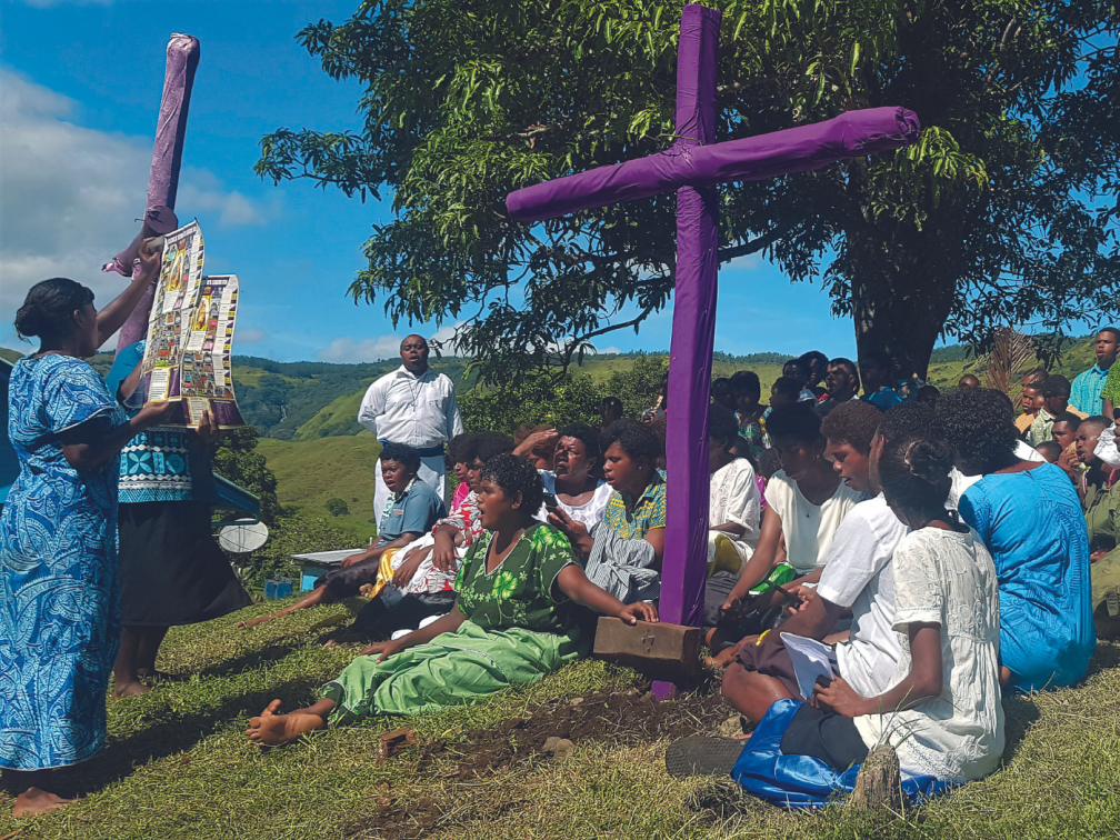 parishioners gather to sing a post Passion hymn