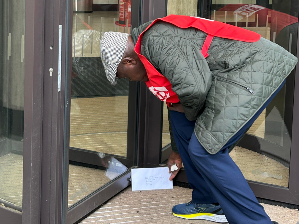 Lord Sentamu delivering a letter to SHELL