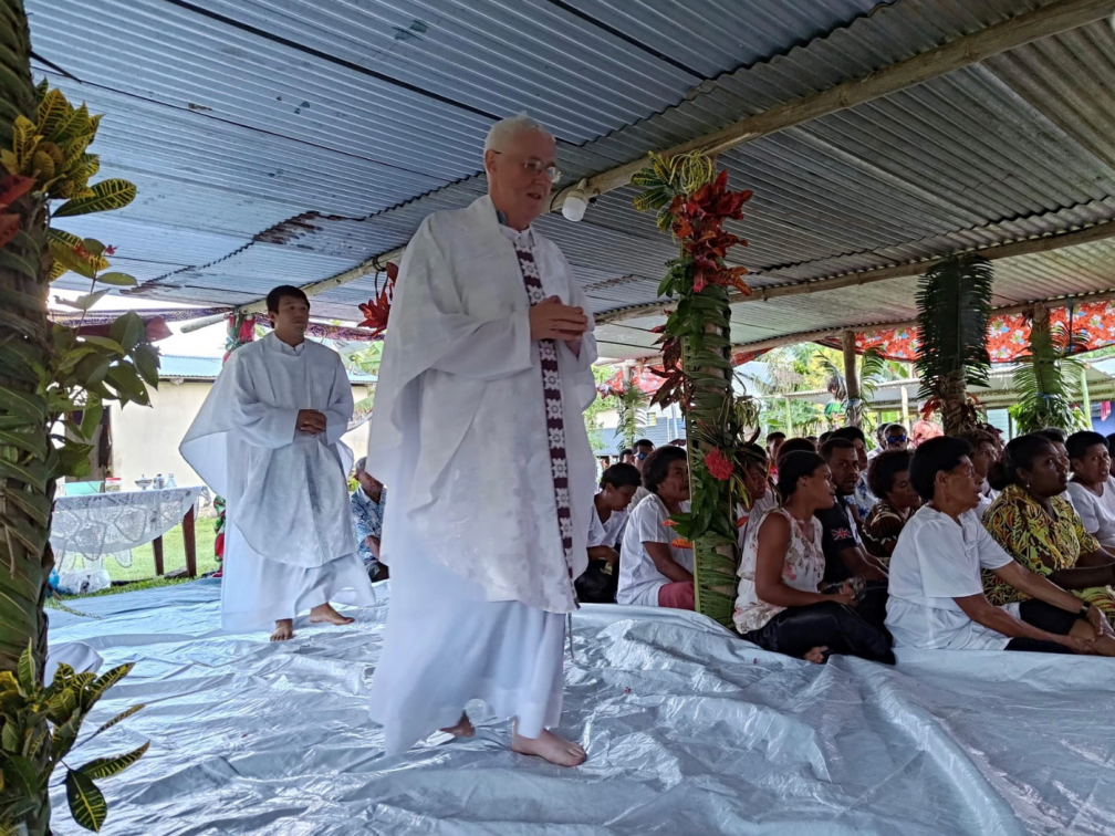 Fr. Carlo Jung Euikyun and Fr. Tim Mulroy join the entrance procession for Mass, followed by a festive celebration, in the Village of Namukalau, a remote outstation of Holy Family Parish, Labasa