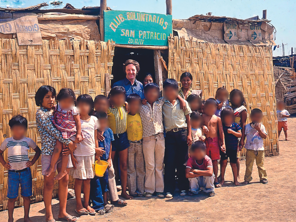 Fr. Pat on mission in Peru outside the very first soup kitchen for children in the parish