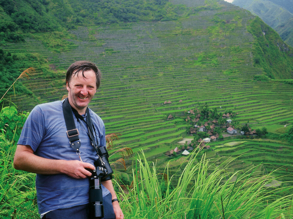 Fr. Pat with camera in Banawe, the Philippines