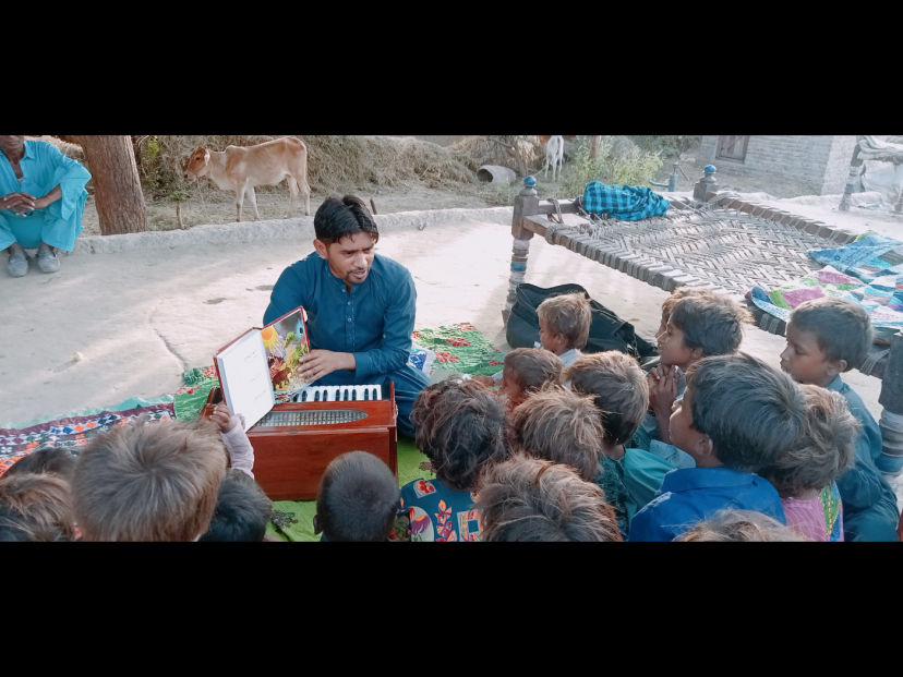 Pastoral worker Daniel Savji tells stories from the Picture Bible while children attentively listen