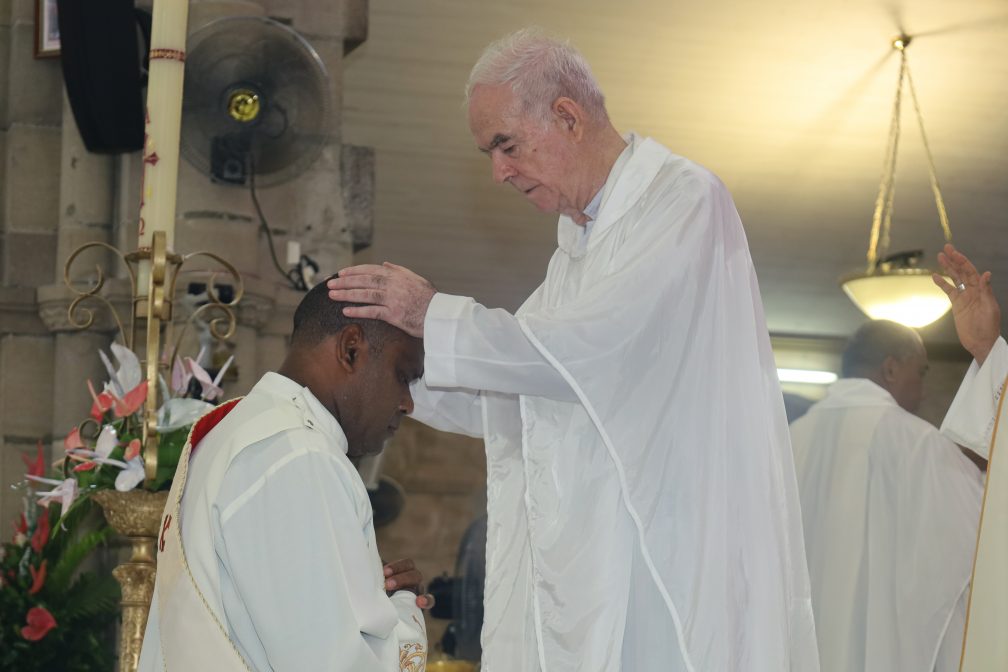 Fr. Frank Hoare lays hands on Iowane during is ordination on 10th April 2024