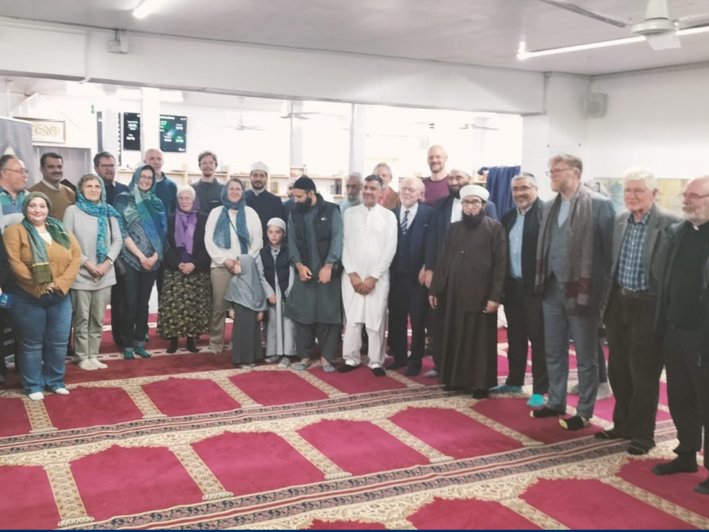 Fr. John Collins, Mauricio Silva attend the Unity Iftar in March 2024