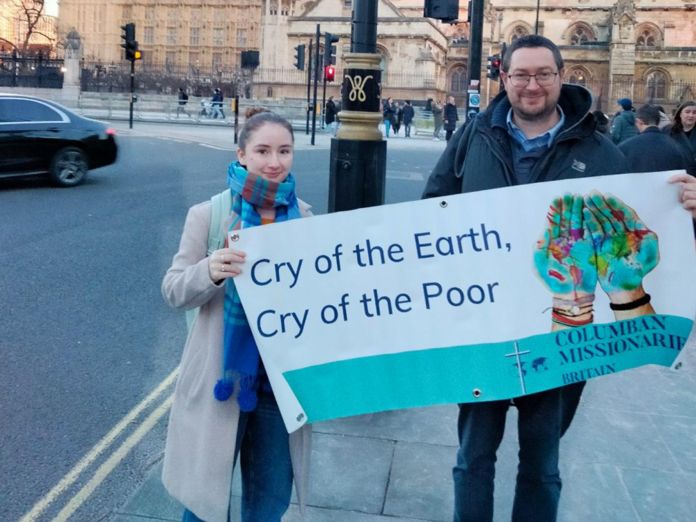 Justice, Peace and Ecology Co-ordinator James Trewby and Faith in Action Volunteer Hanner Lonergan outside the Houses of Parliament