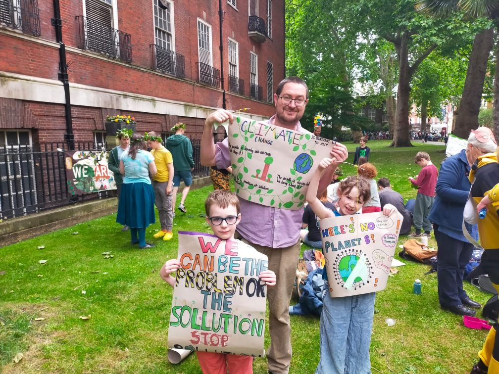 Columban Justice and Peace Co-Ordinator James Trewby with his family at the march