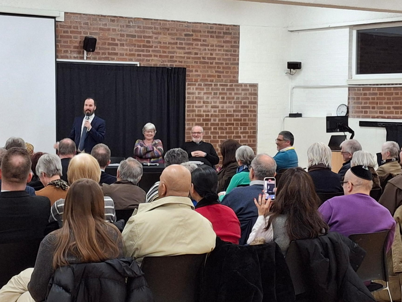 Rabbi Yossi Jacobs speaking during the event