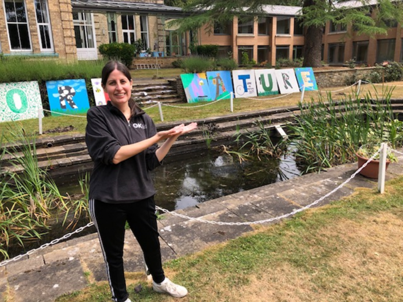 Jackie poses by the pond in the grounds of the Solihull house