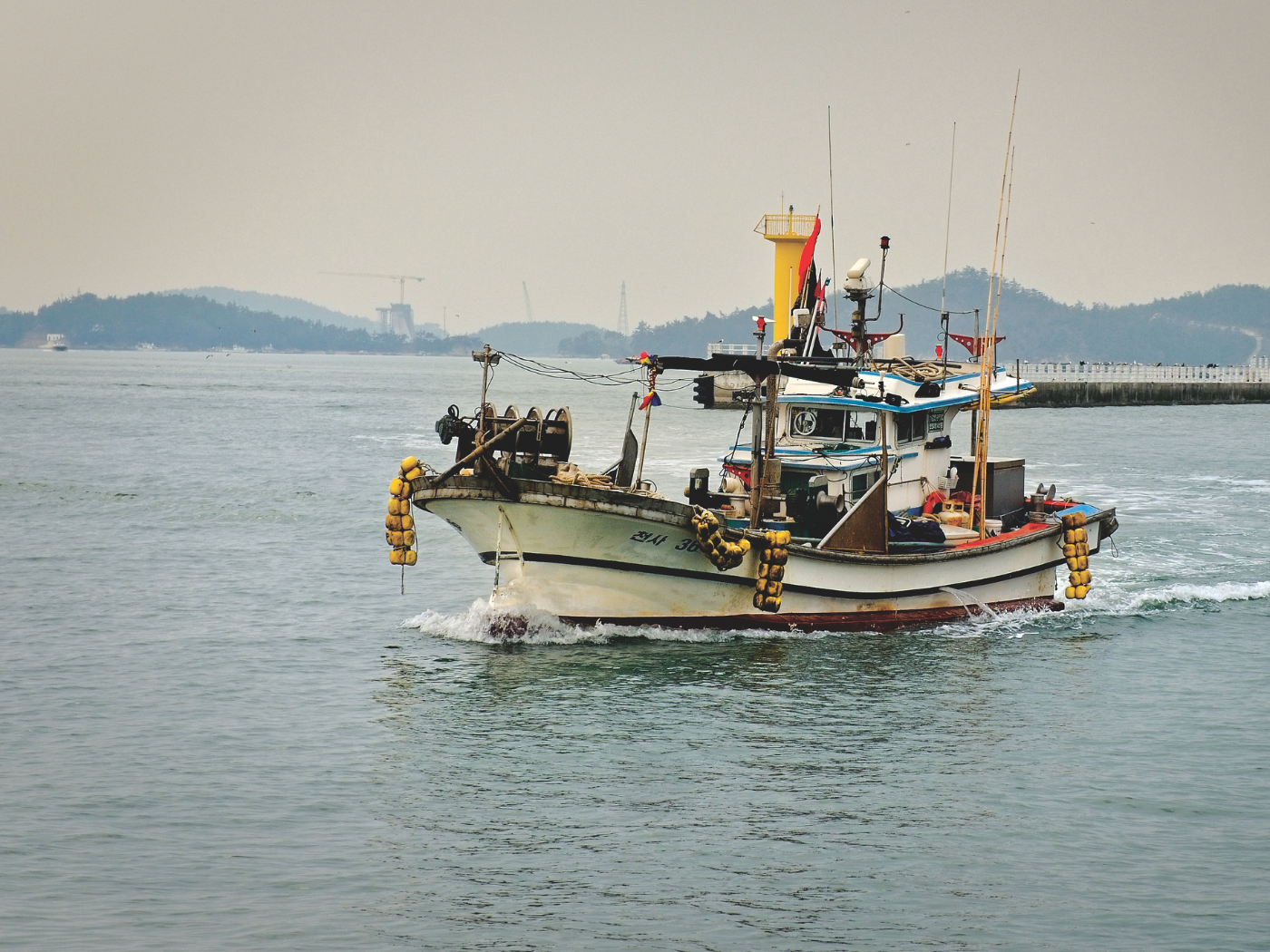 A fishing boat returning to port at North Harbour, Mokpo