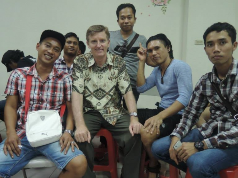 Peter O'Neill listening to the stories of migrant workers as part of his pastoral mission work