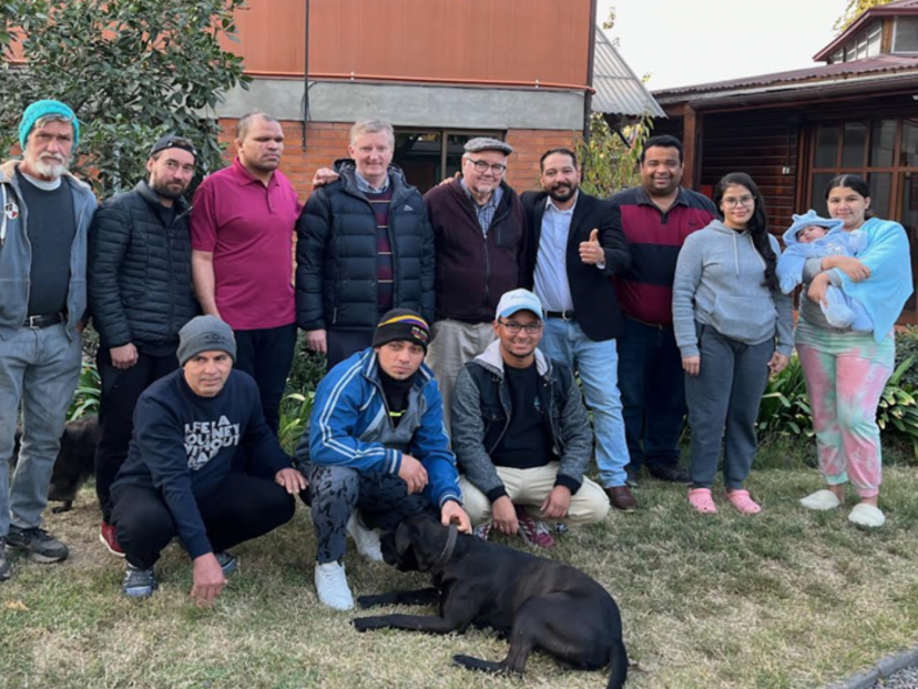 Javier Nuñez (bottom right) Columban Vicar General, Peter O´Neill (back row, fourth from left) and Fr. Dan Harding (back row fifth from left) during Peter's visit to the migrant house in 2023