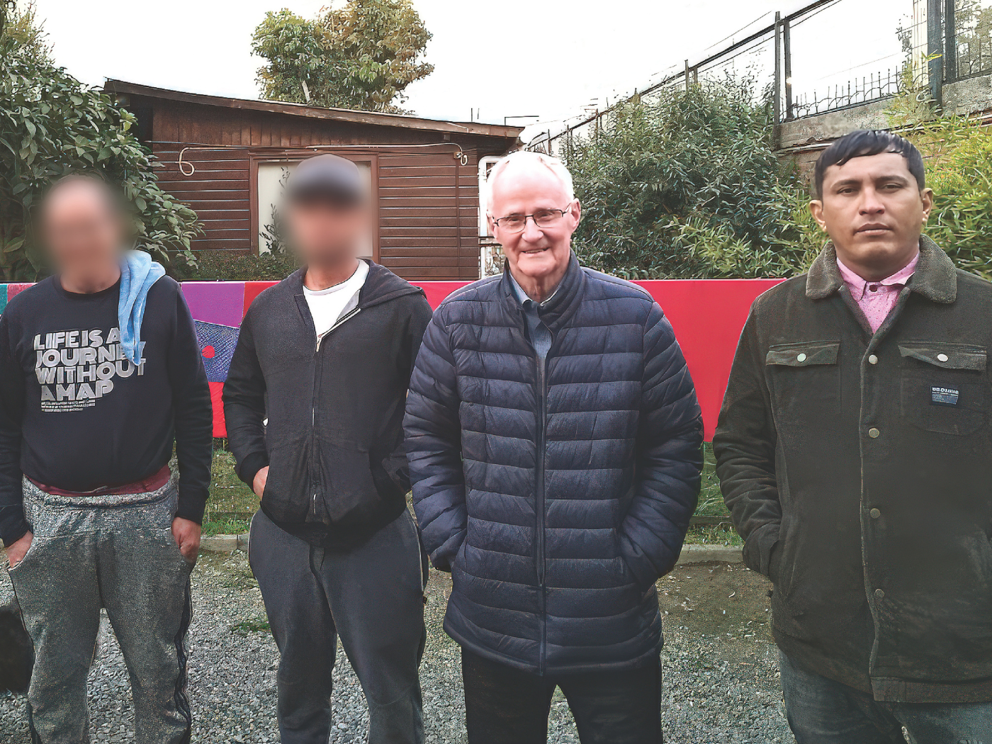 Fr. Alo Connaughton at the Columban Migrant Centre in Santiago with Mariano (first from right) and other migrant men from Colombia and Venezuela