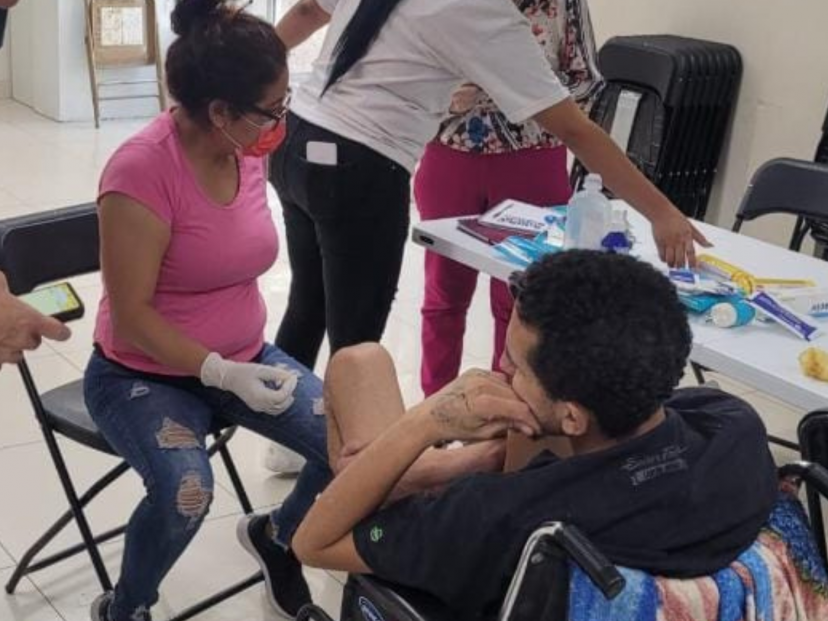 A nurse caring for a migrant who had an accident at work