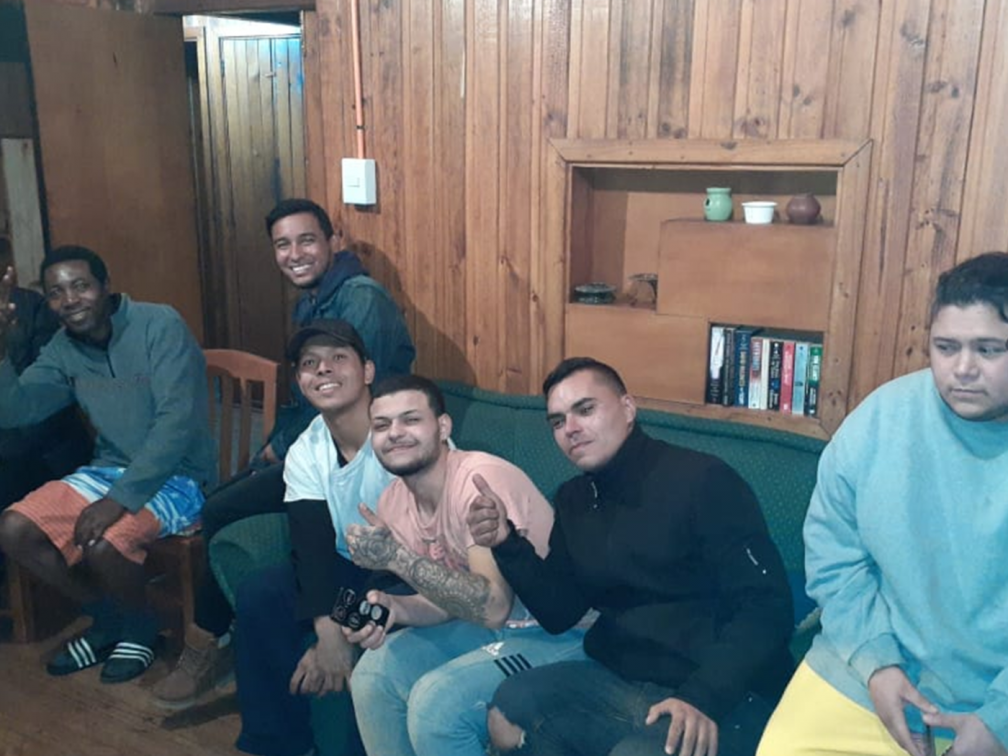 Venezuelan and Haitian men in the Columban Migrant House, 2021. Javier Núñez is third from the right