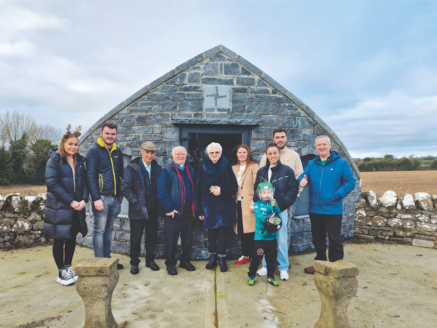 Fr. John McEvoy with the Committee who organised the Mass, Breda Condron and her family, and local historian Mattie Mooney in the middle