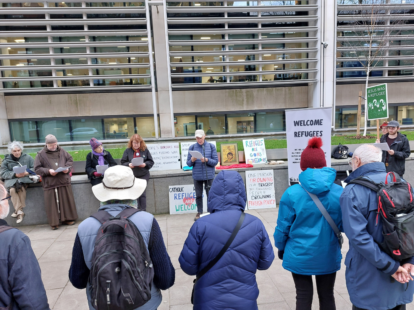 Members of the prayer vigil remember those who died seeking sanctuary