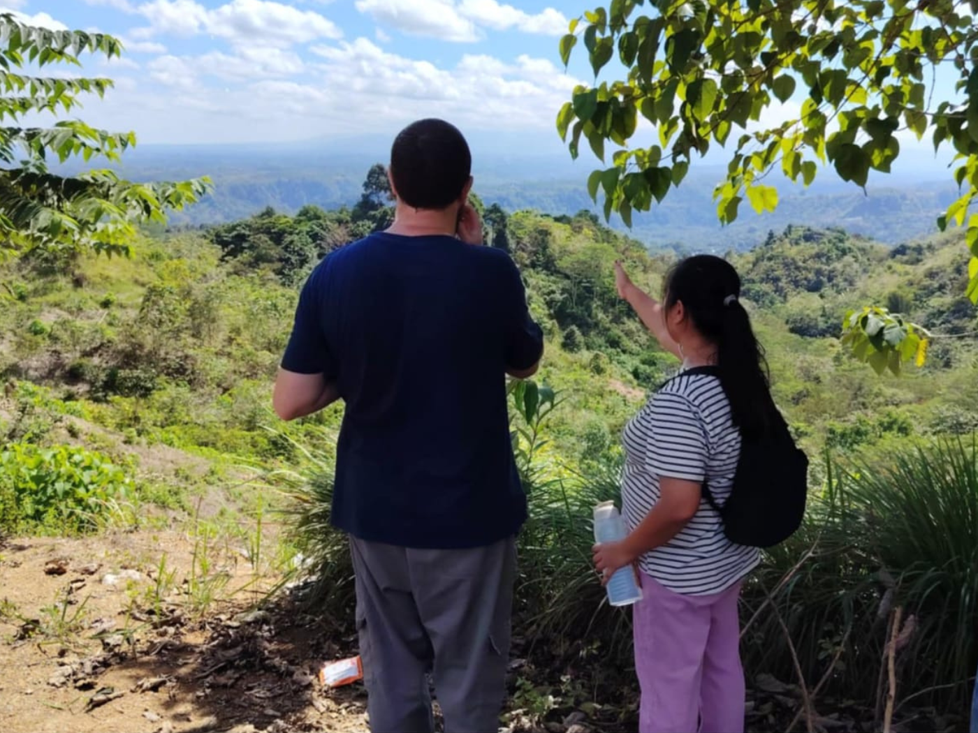 JPE Co-ordinator James Trewby with Marjorie Engcoy visit an area that has been reforested by the Higaonon community with native Lauaan trees, providing new habitats for wildlife