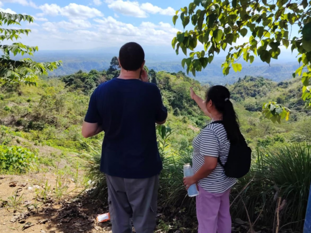 James Trewby and Marjorie Engcoy, Columban Justice, Peace and Integrity of Creation animator in Mindanao view the areas where native tree saplings have been planted