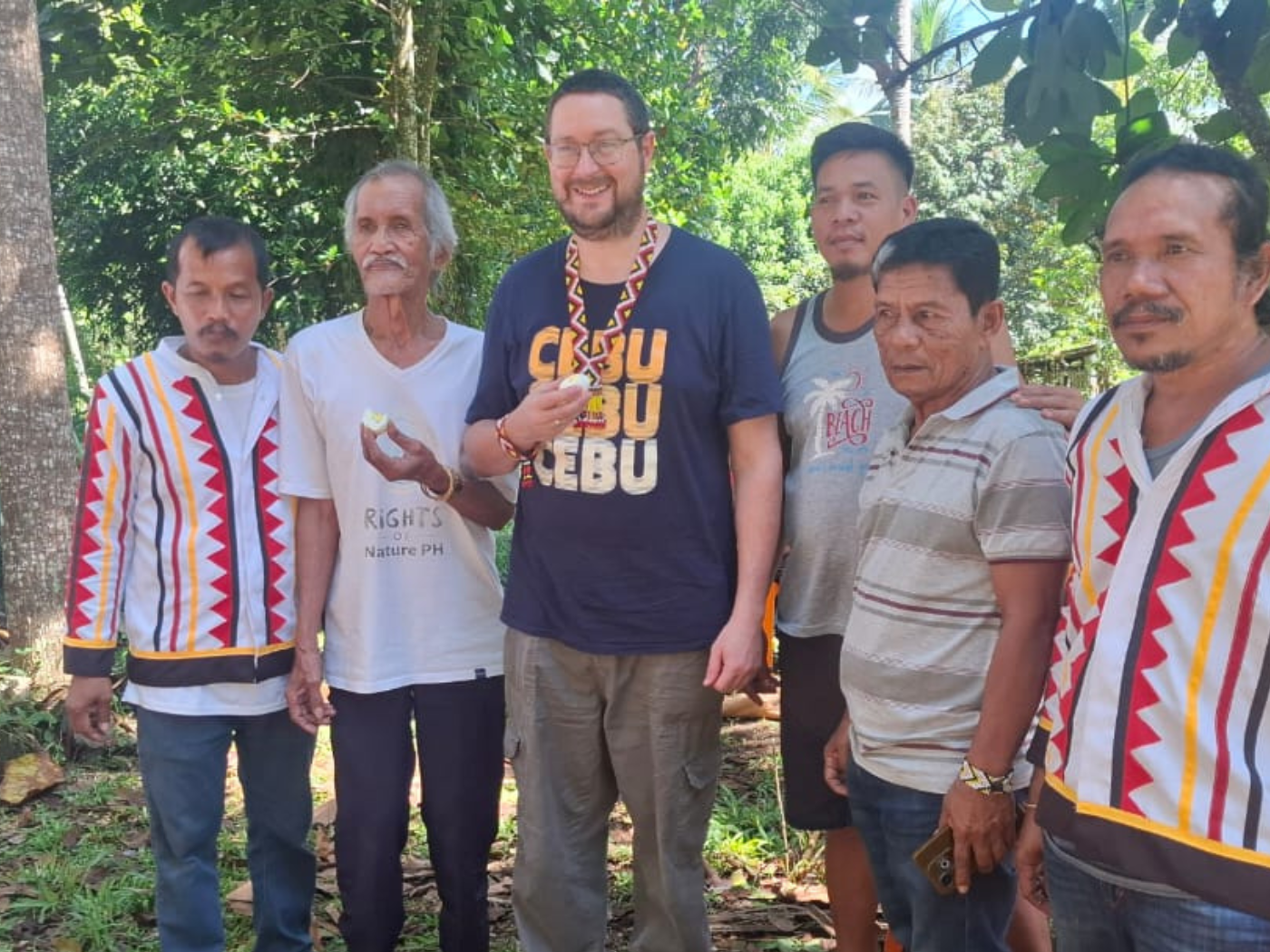 James Trewby with Datus (chiefs) Hapitan and Ontong, and some of the tree-growing volunteers