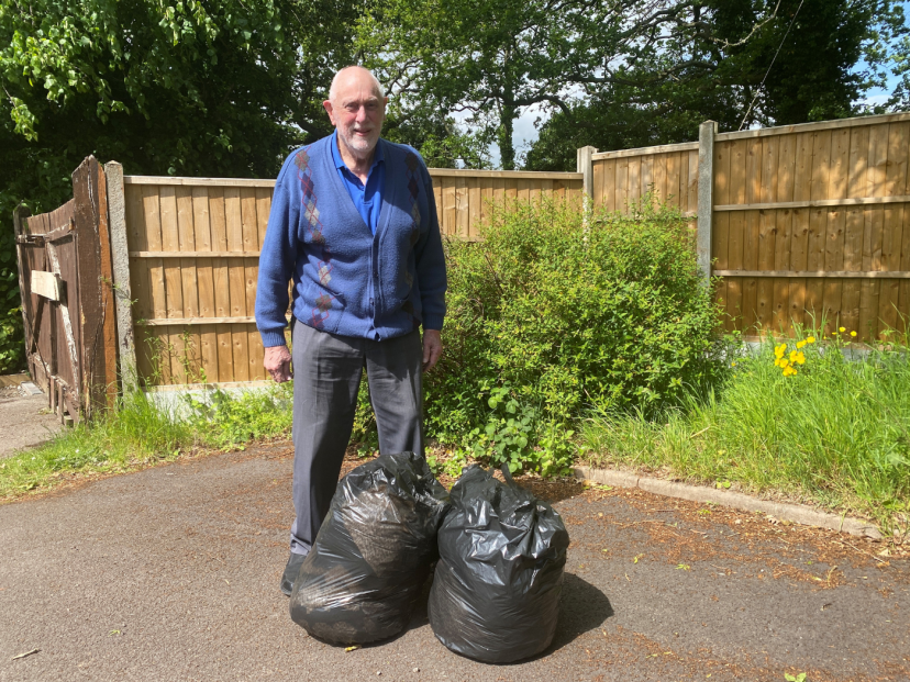 Fr. Ray with bags of donations for those at St. Chads Sanctaury