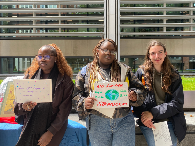 Students with their banners at the vigil utside the Home Office