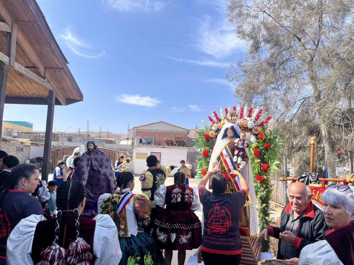 Pilgrims pray before the image of the Virgin outside the Chapel of St. Columban before joining the pilgrimage