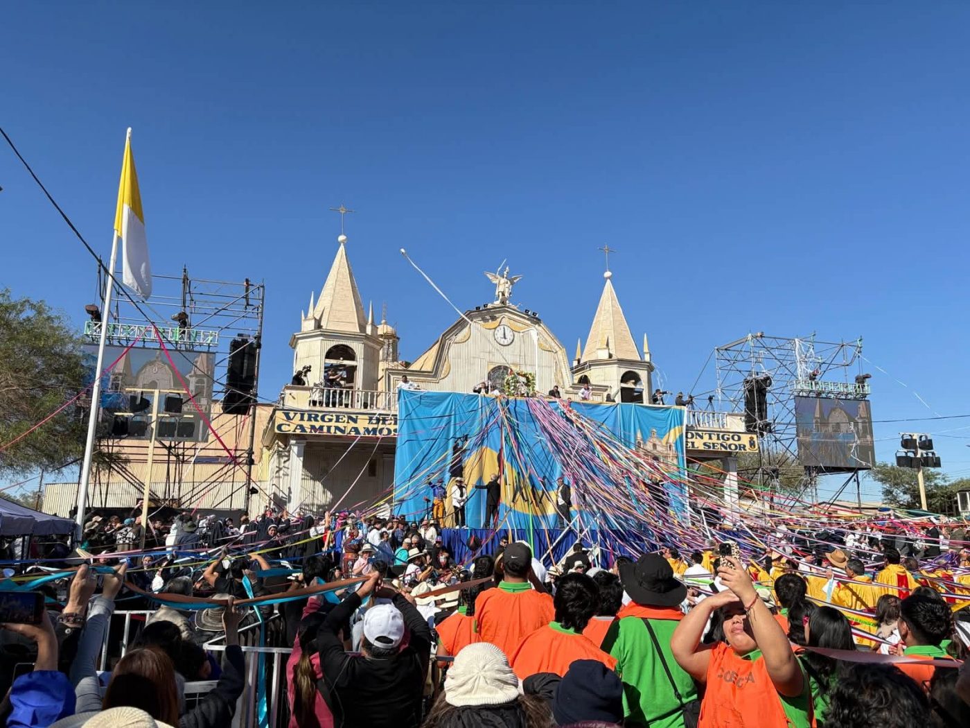 Thousands of pilgrims gather before the Sanctuary of Our Lady of Mount Carmel in La Tirana, northern Chile, where ribbons symbolise promises made to the Virgin