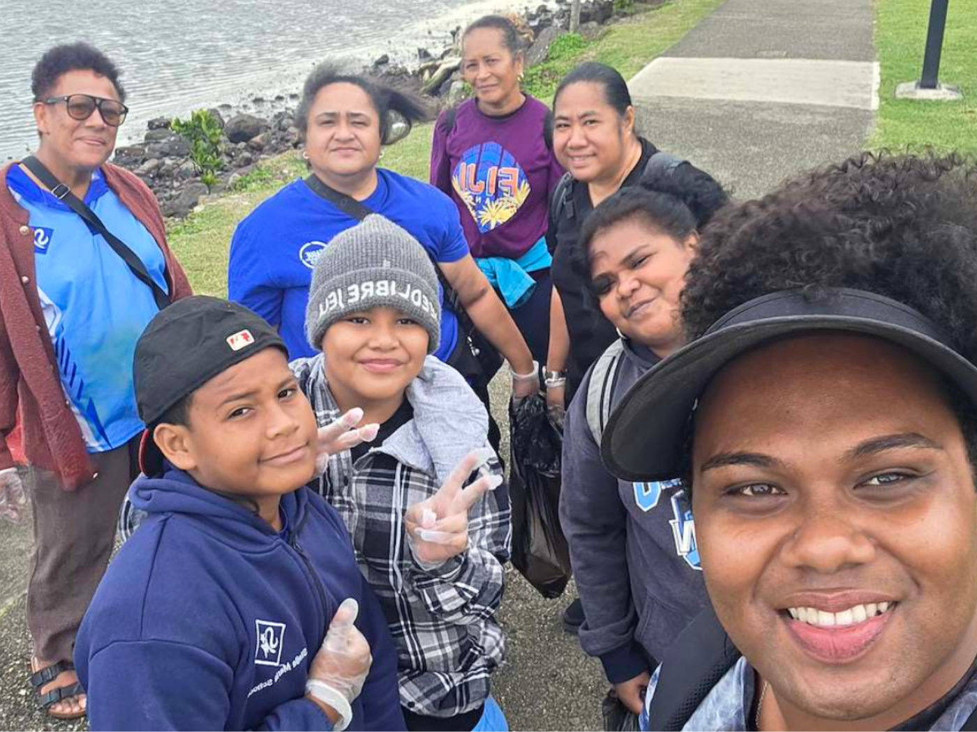 Columban Co-worker Noa Mervyn Tuivunilagi with participants of the beach clean up in Nasese, Suva